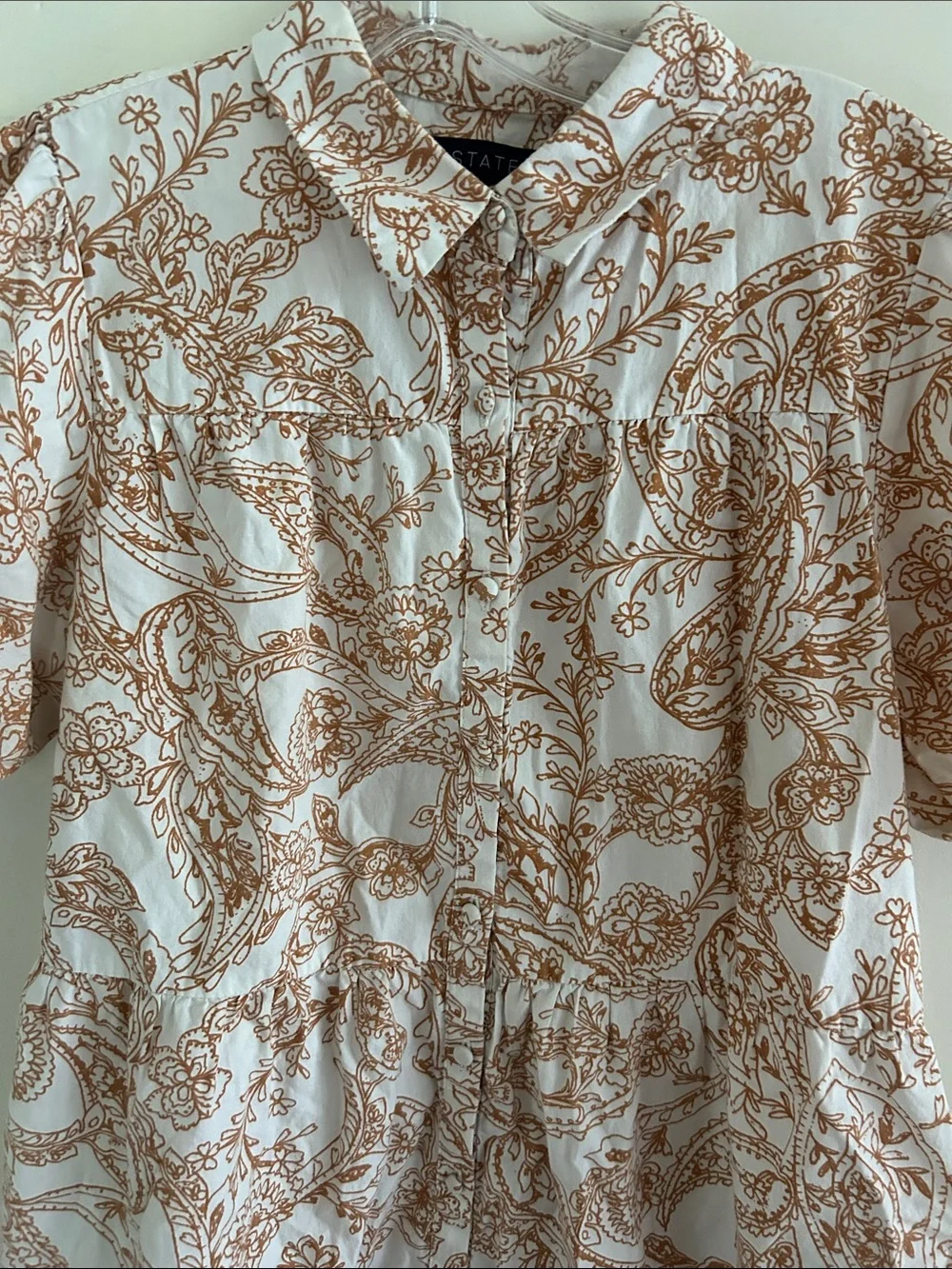 1. STATE dress is a brown and white paisley print mini dress with puff sleeves